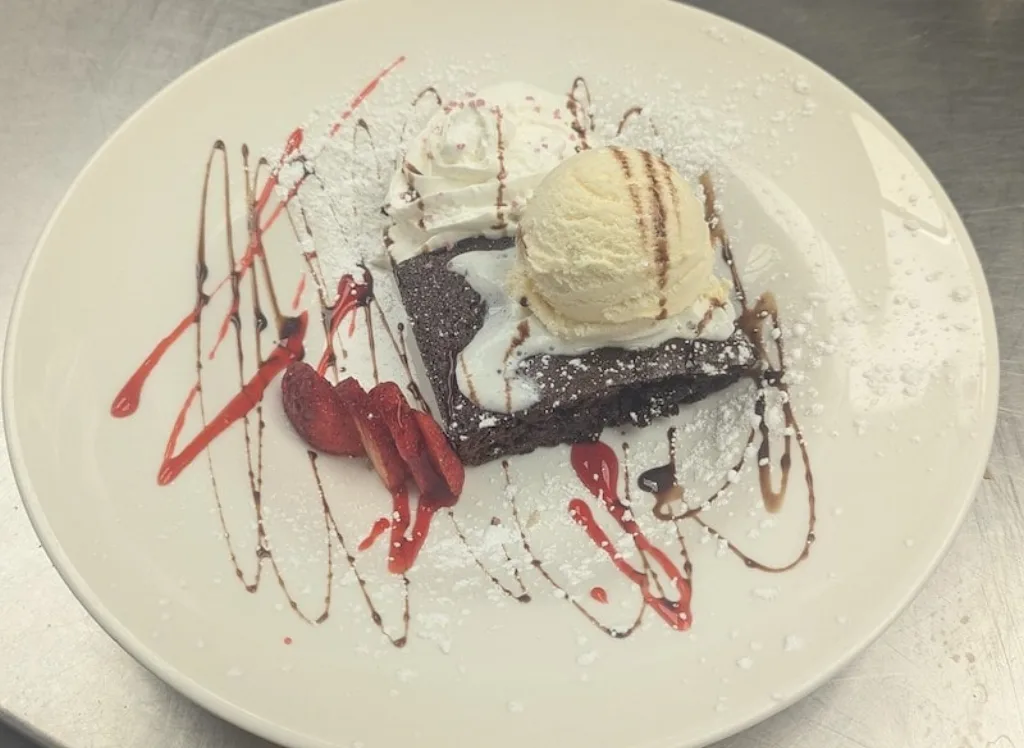 Decadent chocolate brownie sundae dessert at Longley's Restaurant.