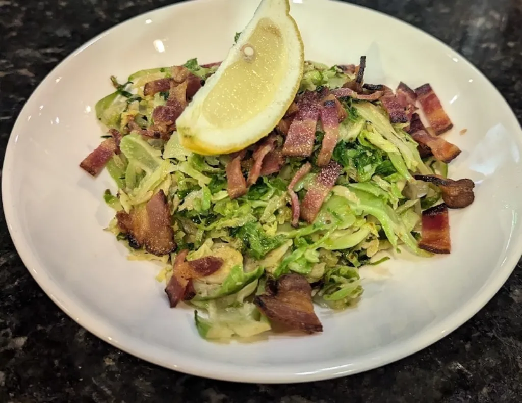 Sautéed Brussels sprouts with bacon, a popular side dish at Longley's.