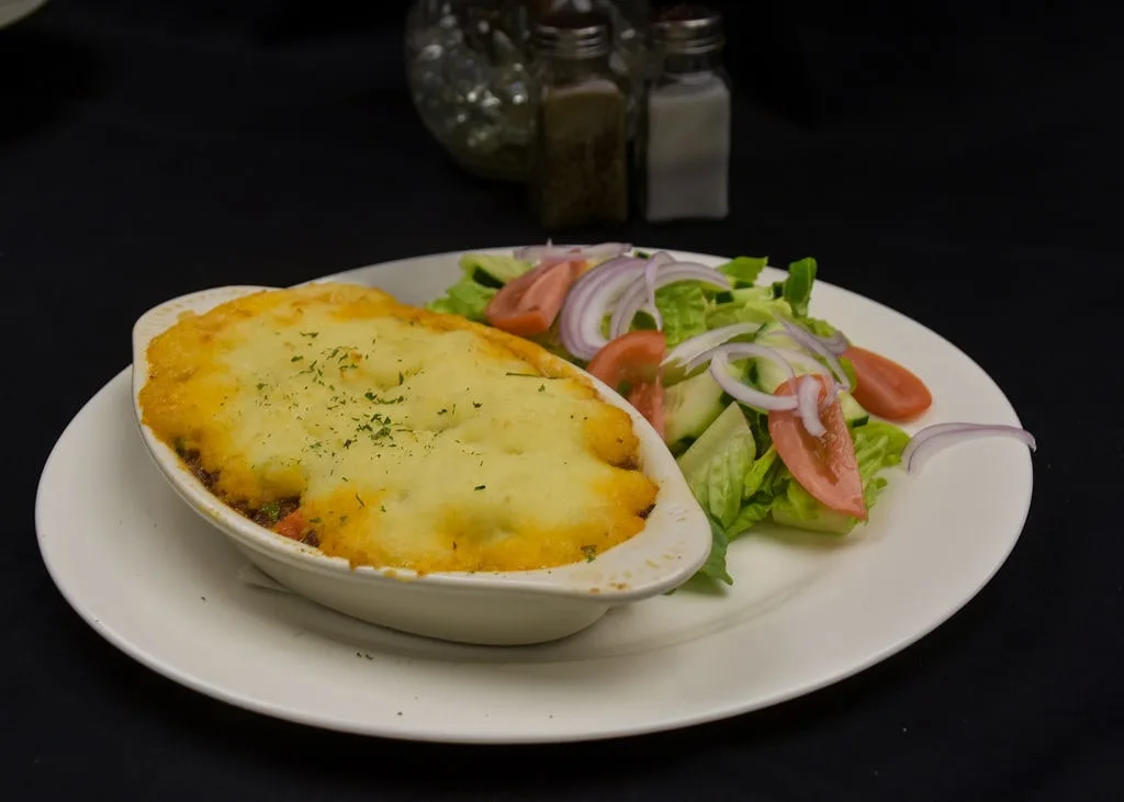 Traditional Shepherd's Pie casserole served with a fresh garden salad.